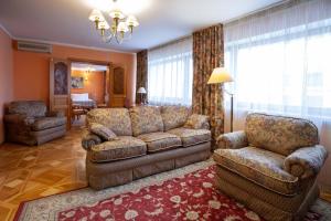 a living room filled with furniture and a fireplace at Hotel Krasnoyarsk in Krasnoyarsk