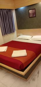 Postel nebo postele na pokoji v ubytování Hotel Aston