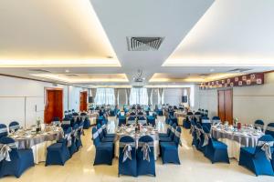 a banquet hall with tables and chairs in a room at Saigon Hotel in Ho Chi Minh City