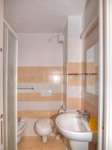 a bathroom with a sink and a toilet and a tub at Agriturismo Ca' Di Trincia in Pietra Ligure
