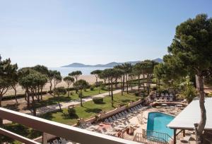 a view of the beach from the balcony of a resort at Résidence du Lido in Argelès-sur-Mer