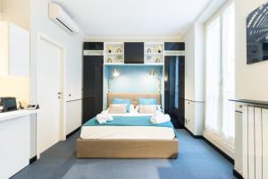 A bed or beds in a room at Cosy Studio Brera & Moscova!