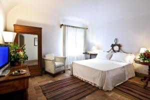 A bed or beds in a room at Casa la Carrubbazza