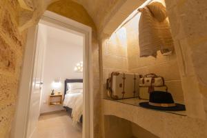 Postel nebo postele na pokoji v ubytování Peninsula Apartments-Appartamento Pietrabianca