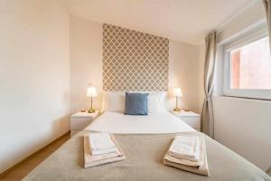 Postel nebo postele na pokoji v ubytování Sé Guesthouse