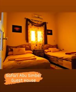 a room with two beds in a guest house at Safari Abu Simbel in Abu Simbel