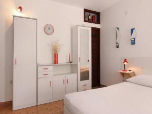 Ένα ή περισσότερα κρεβάτια σε δωμάτιο στο Apartments Nadia