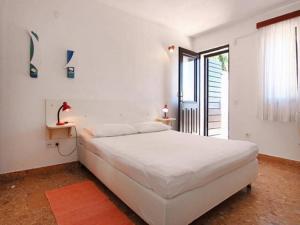 Ένα ή περισσότερα κρεβάτια σε δωμάτιο στο Apartments Nadia