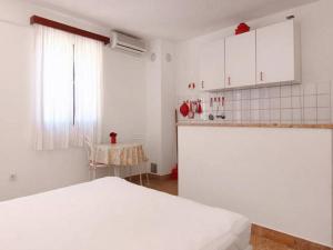 Ένα ή περισσότερα κρεβάτια σε δωμάτιο στο Apartments Nadia +24 φωτογραφίες