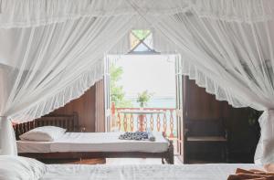 En eller flere senge i et værelse på Hotel Neptune Bay unawatuna beach