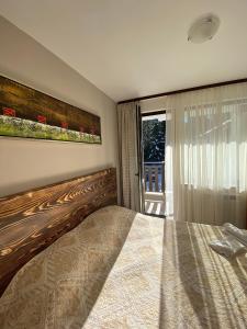 Postel nebo postele na pokoji v ubytování Borovets Gardens Ski Apartment