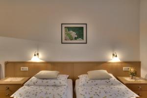 Postel nebo postele na pokoji v ubytování Garni Oskar Appartments