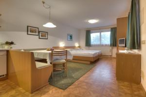 Postel nebo postele na pokoji v ubytování Garni Oskar Appartments
