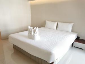 Postel nebo postele na pokoji v ubytování A Sleep Bangkok Sathorn