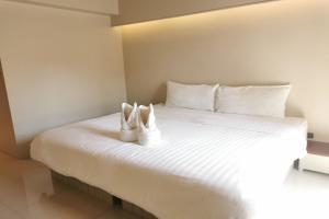 Tempat tidur dalam kamar di A Sleep Bangkok Sathorn