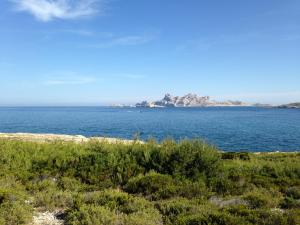 an island in the middle of a large body of water at L'Eau Des Collines in Marseille