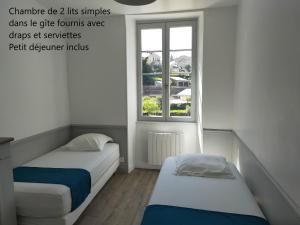 מיטה או מיטות בחדר ב-Gîte Les Pieds dans l'Olt - Ultreïa
