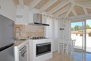 Кухня или мини-кухня в La casa di Ziu Menicu
