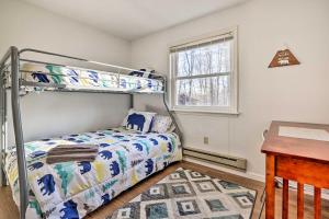 a bedroom with a bunk bed and a desk at 4 Mi to Tobyhanna State Park Home with Fire Pit in Tobyhanna +27 photos