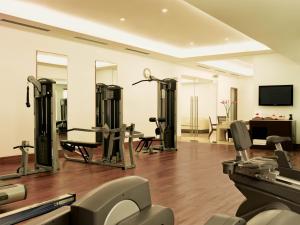 a gym with several exercise equipment in a room at Trident Chennai in Chennai