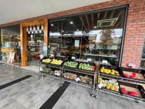 a grocery store with fruits and vegetables on display at Deluxe Swiss Garden Residences Bukit Bintang City Center in Kuala Lumpur