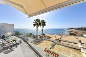 a view of the ocean from the balcony of a house at Apartment Nueva Suecia CR715 by VillaGranCanaria in San Agustin