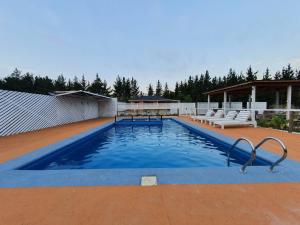 Bazén v ubytování Cabañas Olas del Bosque nebo v jeho okolí