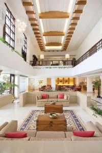 a living room with couches and a table at Trident Chennai in Chennai