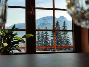 a window with a view of a snowy mountain at Willa Leluja in Zakopane