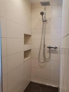 a bathroom with a shower with a shower head at Bonapart in Stumm
