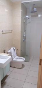 a bathroom with a toilet and a shower and a sink at M City Center Jalan Ampang Lakeview KLCC KL Tower Merdeka 118 TRX View in Kuala Lumpur
