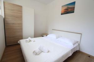 Posteľ alebo postele v izbe v ubytovaní Apartman Darija