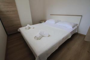 Posteľ alebo postele v izbe v ubytovaní Apartman Darija