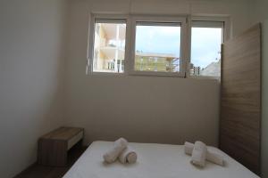 Posteľ alebo postele v izbe v ubytovaní Apartman Darija