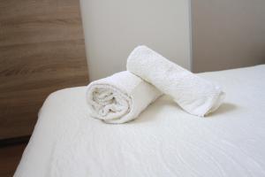 Posteľ alebo postele v izbe v ubytovaní Apartman Darija