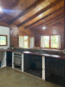 a kitchen with a stove and a sink at Casa IMA in San Lorenzo