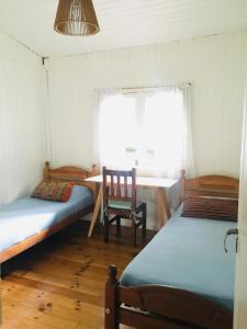 A bed or beds in a room at Verde Lujan Delta