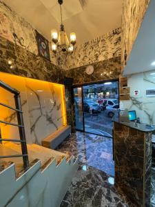 a lobby with a reception desk and a car dealership at ERSOY EGE APART OTEL in Antalya