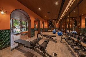 a gym with a row of exercise bikes in a room at Huahin mountain view room near the beach in Hua Hin