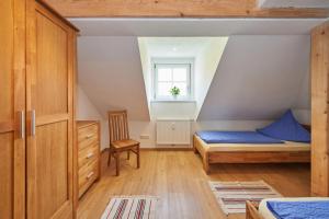 a small bedroom with a bed and a window at Gästehaus Marzoll in Bad Reichenhall