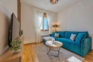 Un televizor și/sau centru de divertisment la Apartman Berolina 2