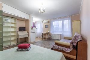 אזור ישיבה ב-Standard Brusnika Apartment na Profsoyuznoy