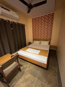 Postel nebo postele na pokoji v ubytování Hotel Vardhan