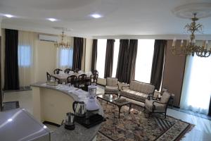 A seating area at Jewel Fayed Hotel Még 37 kép