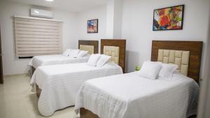 Postel nebo postele na pokoji v ubytování Solaris Hotel