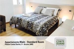 Postel nebo postele na pokoji v ubytování Conte Durini Apartments & Rooms