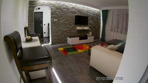 TV a/nebo společenská místnost v ubytování Hotel Marasesti + 37 fotografií