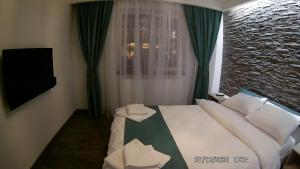 Postel nebo postele na pokoji v ubytování Hotel Marasesti