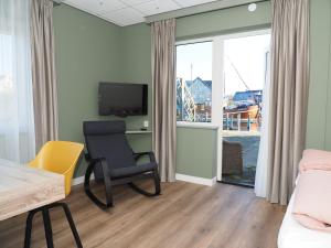 TV a/nebo společenská místnost v ubytování Hotel Workum