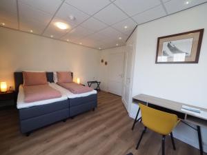 Postel nebo postele na pokoji v ubytování Hotel Workum